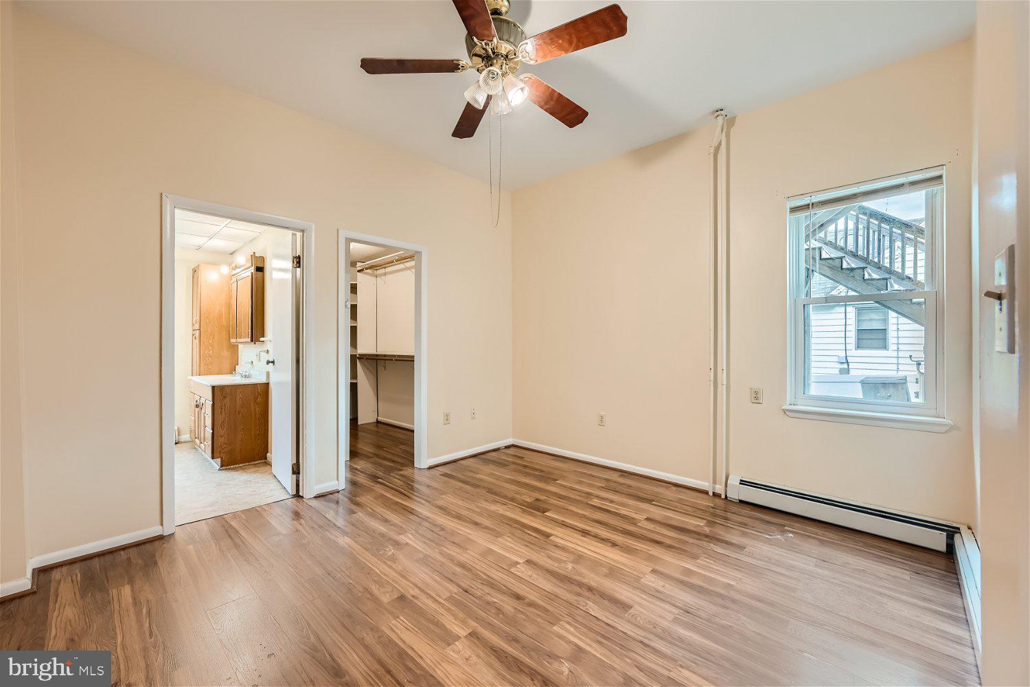 716 South Camp Meade Road, Unit A Linthicum Heights, MD 21090 - Photo 11 of 11 wooden floor in an empty room with a window