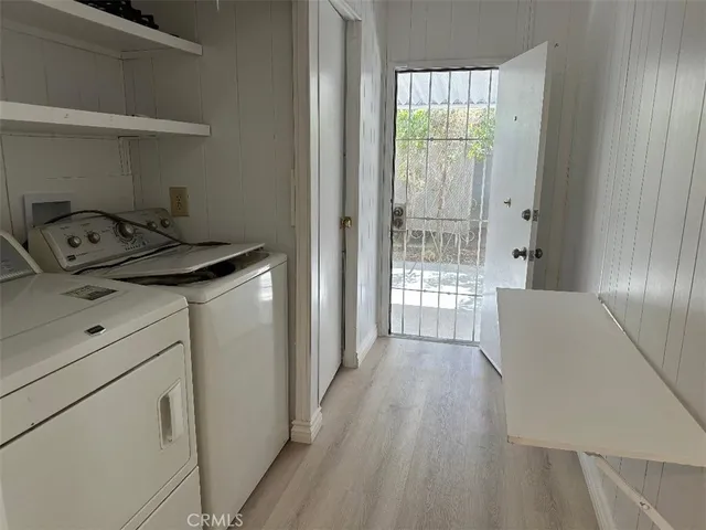 a view of an entryway with wooden floor