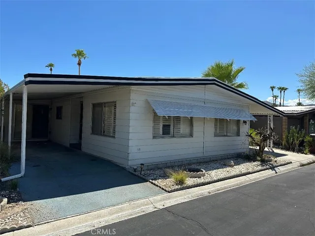 a view of a house with a street