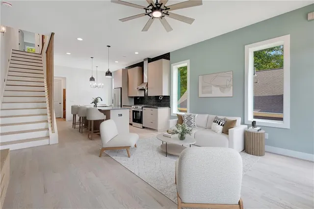 a view of kitchen with sink and refrigerator