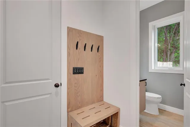 a view of a kitchen with stainless steel appliances granite countertop a sink and a fireplace