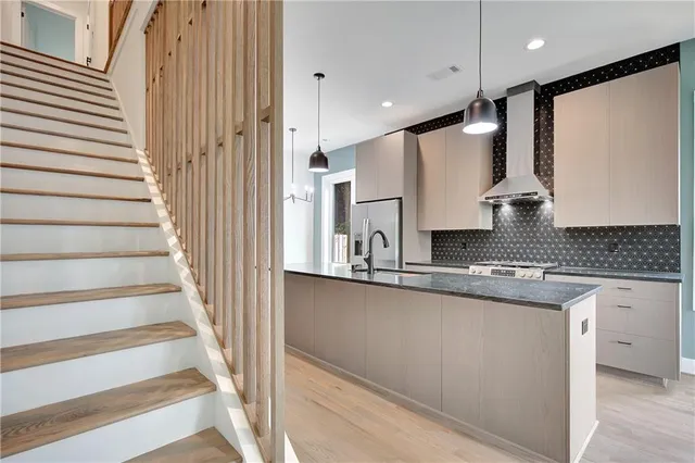 a spacious bedroom with a large bed and a large window