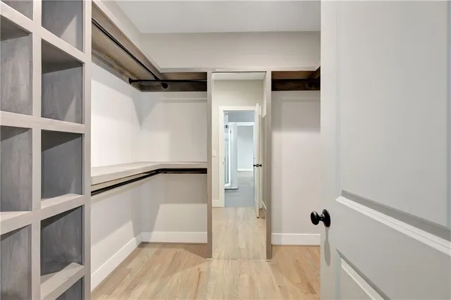 a bedroom with a large bed and a window