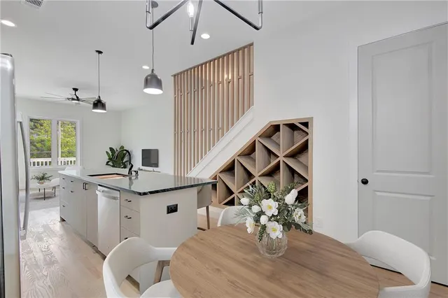 a very nice looking dining room with a table and chairs