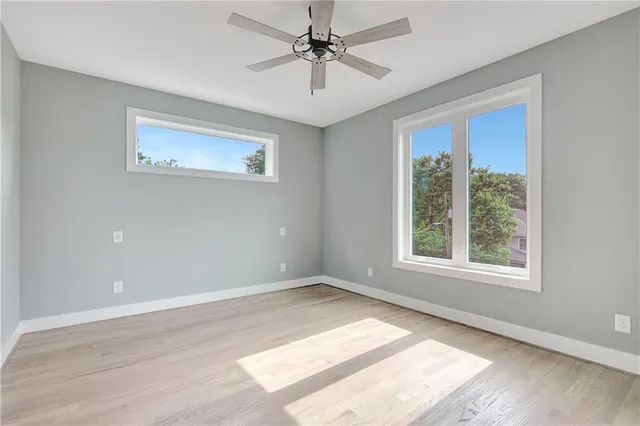 a bathroom with double vanity sinks and a mirror