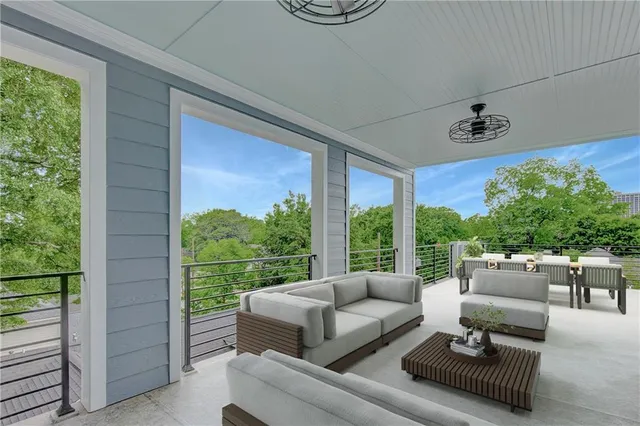 a view of a house with porch and garden