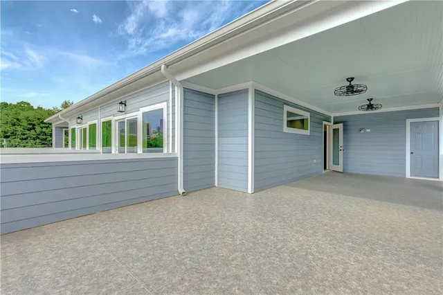 a view of a street with wooden fence