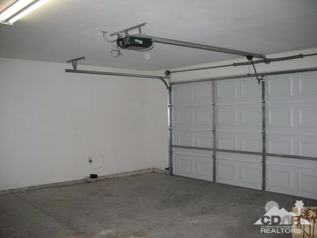 13827 Ocotillo Road Desert Hot Springs, CA 92240 - Photo 12 of 15 a view of a room with racks on the wall