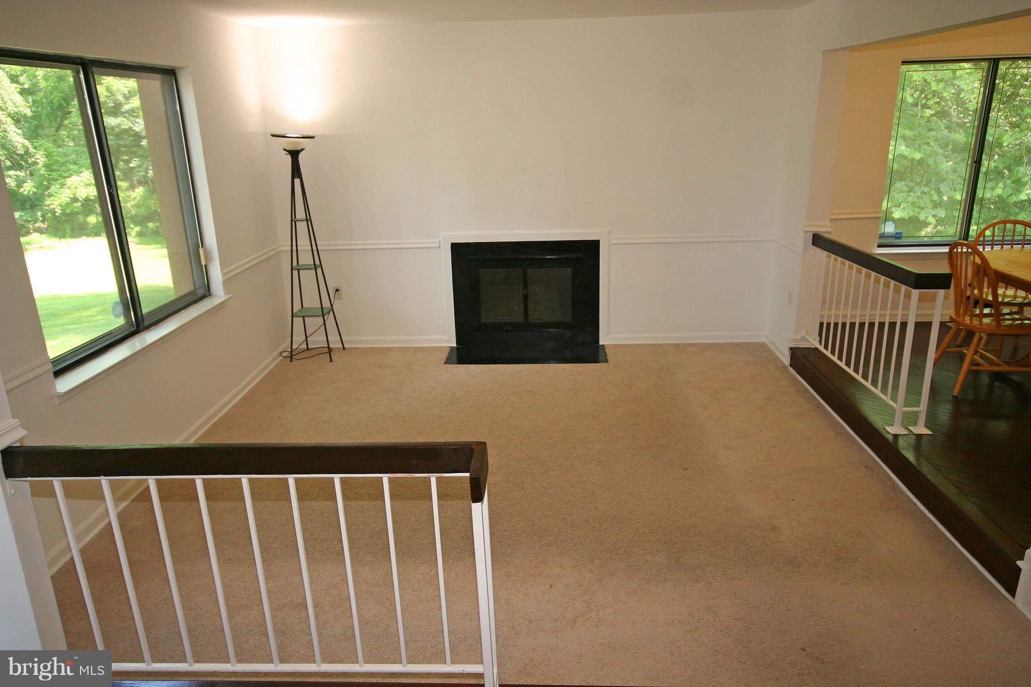8947 Centerway Road Gaithersburg, MD 20879 - Photo 5 of 25 Living Room With Cozy Fireplace