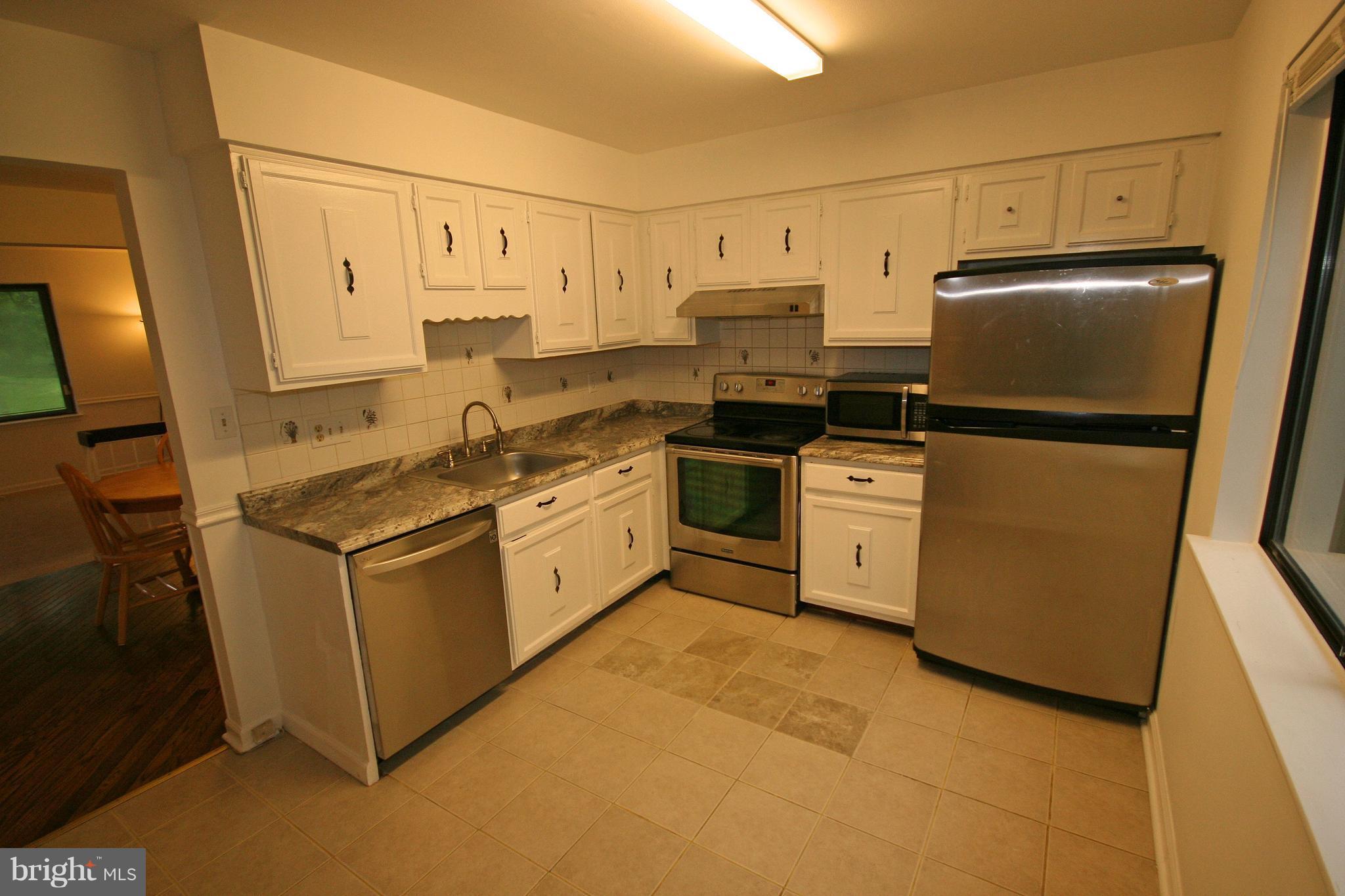 8947 Centerway Road Gaithersburg, MD 20879 - Photo 8 of 25 Kitchen With Stainless Steel Appliances