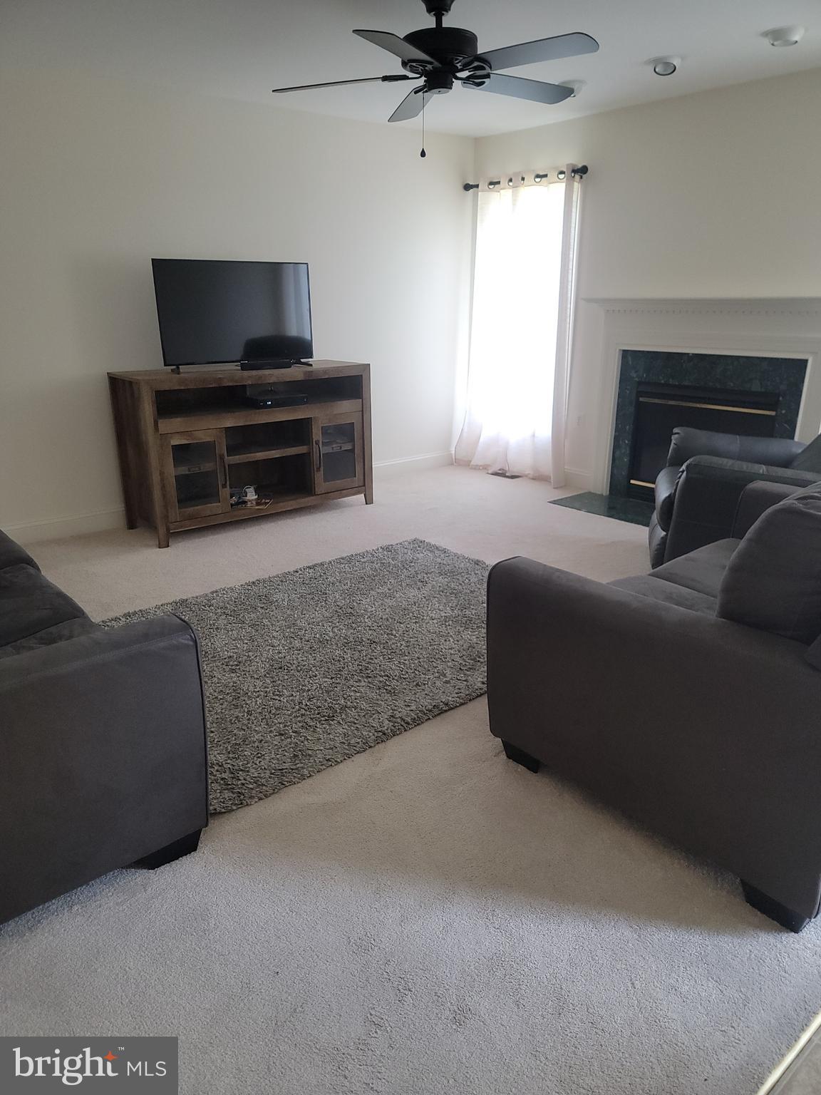 915 Virginia Avenue Culpeper, VA 22701 - Photo 18 of 24 a living room with furniture and a flat screen tv