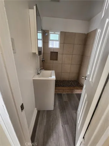 a bathroom with a sink and mirror