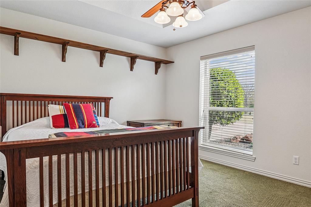 1006 Cochran Road Argyle, TX 76226 - Photo 19 of 40 3rd bedroom with tray ceiling and trophy shelf