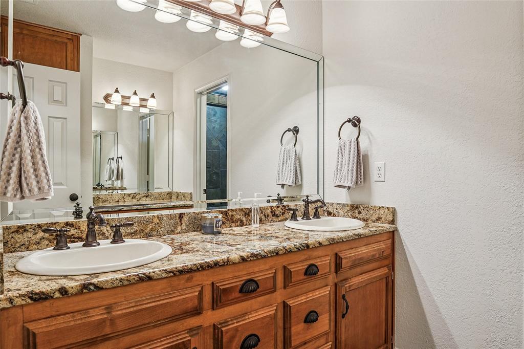 1006 Cochran Road Argyle, TX 76226 - Photo 20 of 40 Double sinks and a separate vanity with shower and toilet