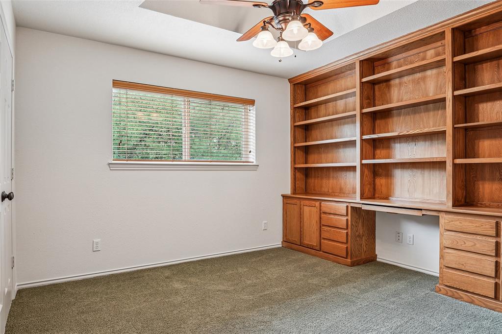 1006 Cochran Road Argyle, TX 76226 - Photo 21 of 40 4th bedroom or office with built in Oak cabinets and desk