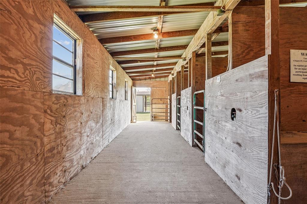 1006 Cochran Road Argyle, TX 76226 - Photo 30 of 40 One of 2 stall hallways with water and electric for each stall
