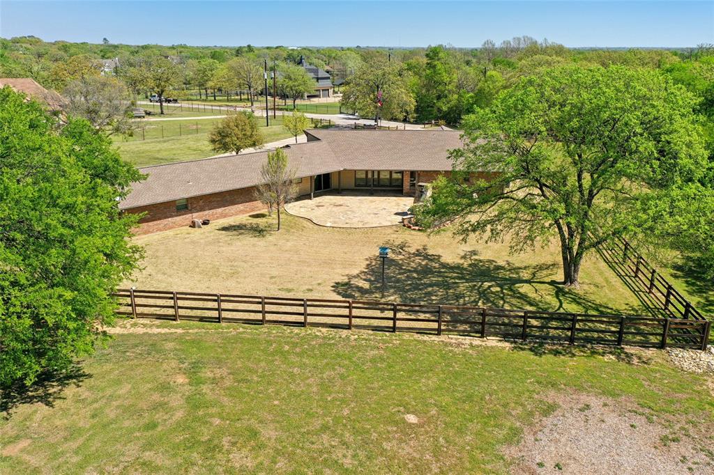1006 Cochran Road Argyle, TX 76226 - Photo 32 of 40 Aerial view of backyard with large stone patio and fireplace