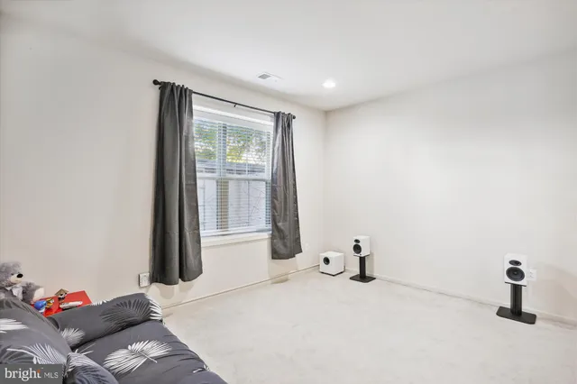 a bathroom with a sink a toilet and shower curtain