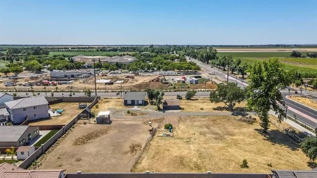 a bathroom with a granite countertop sink and a toilet