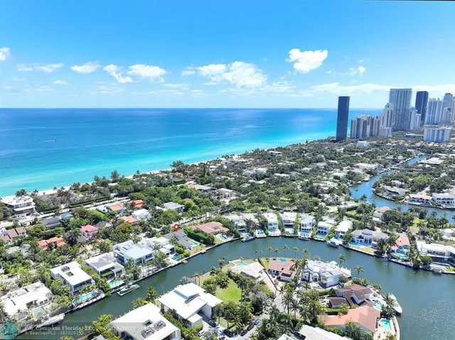 a utility room with cabinets washer and dryer