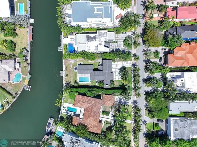 a bathroom with a sink toilet vanity and tub
