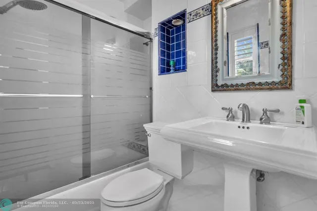 a view of a house with swimming pool and sitting area