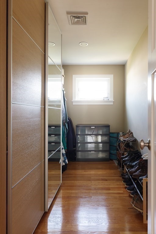 79 Bay State Road Arlington, MA 02474 - Photo 17 of 31 a view of room with window and wooden floor