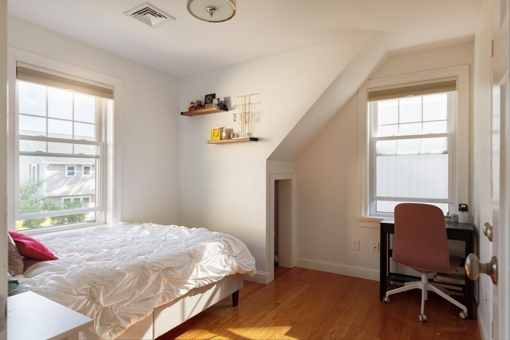 79 Bay State Road Arlington, MA 02474 - Photo 20 of 31 a bedroom with a bed and a window