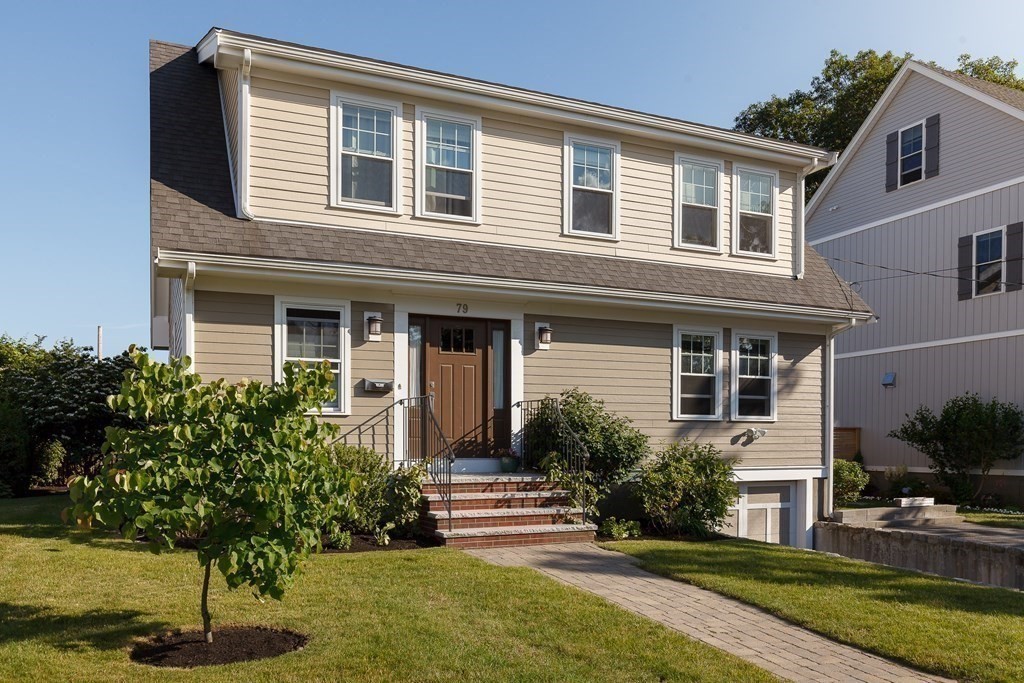 79 Bay State Road Arlington, MA 02474 - Photo 2 of 31 a front view of a house with garden
