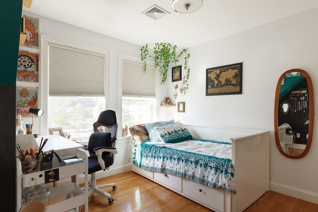 79 Bay State Road Arlington, MA 02474 - Photo 22 of 31 a bedroom with furniture and a window