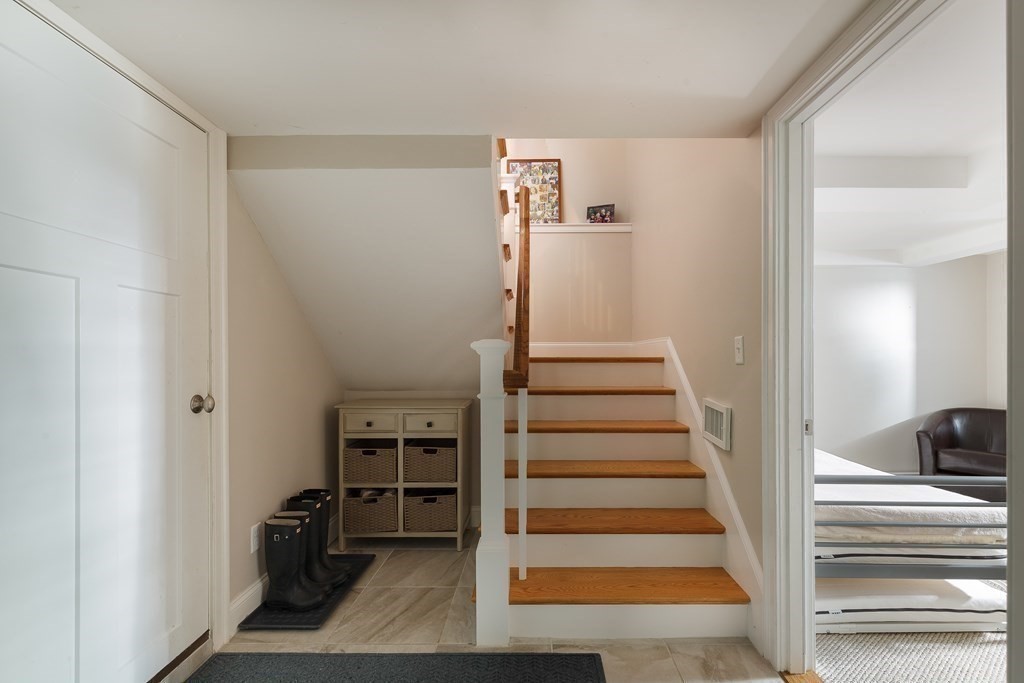 79 Bay State Road Arlington, MA 02474 - Photo 26 of 31 a view of entryway and hall with wooden floor