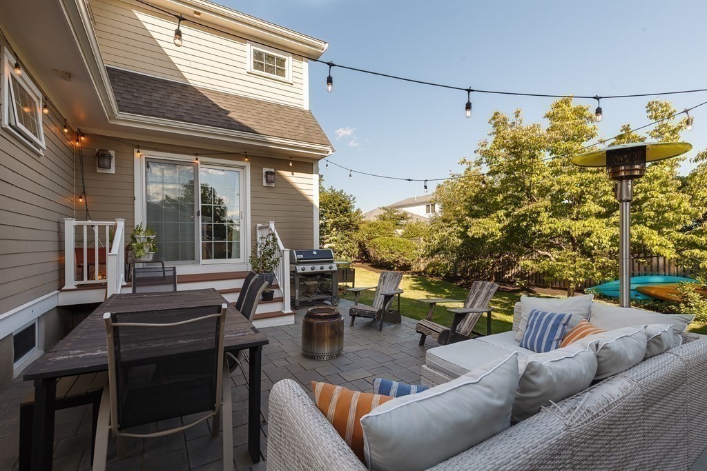 79 Bay State Road Arlington, MA 02474 - Photo 27 of 31 a view of a patio with couches table and chairs and potted plants