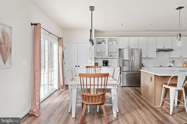 a view of a bathroom with a tub shower and mirror