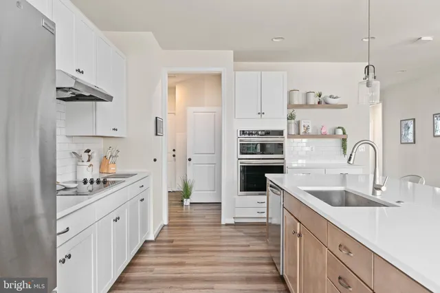 a very nice looking room with wooden floor and entryway