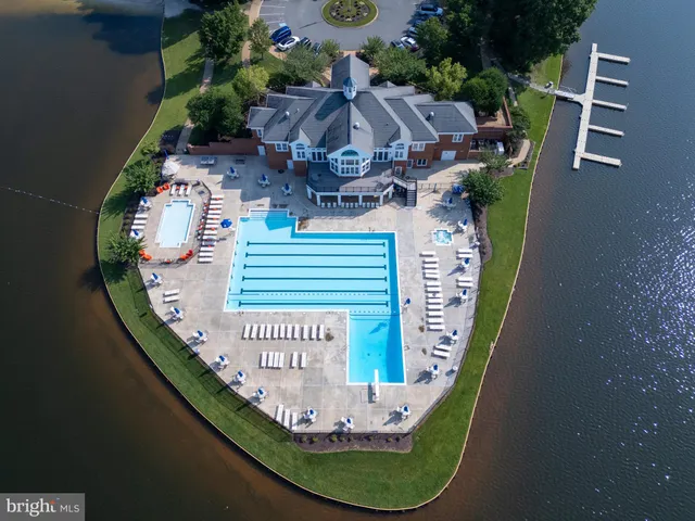 a view of a swimming pool with sitting area