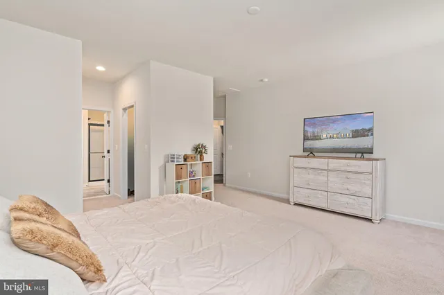 a bathroom with a toilet a sink and shower