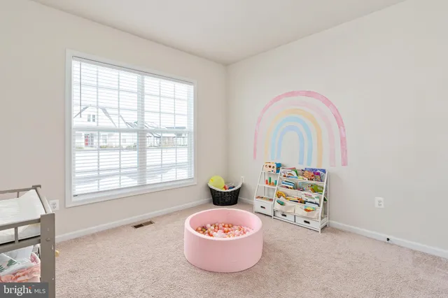 an aerial view of a house with outdoor space and lake view