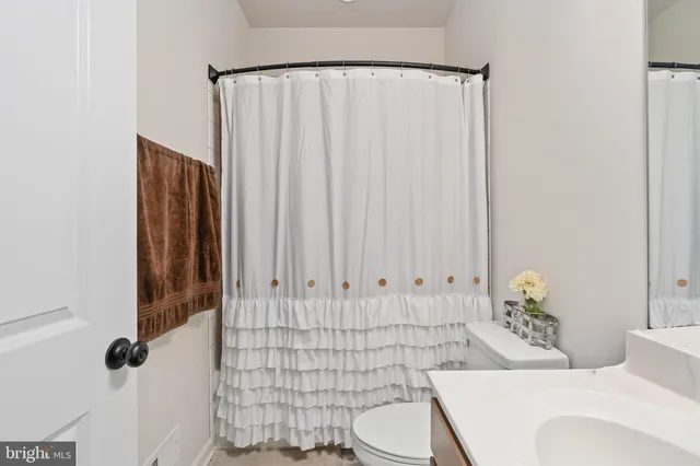 an aerial view of a house with swimming pool lake view and mountain view