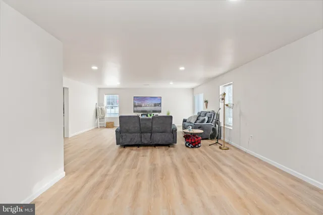 an aerial view of a house with table and chairs