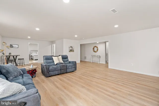 an aerial view of a house with a yard and lake view