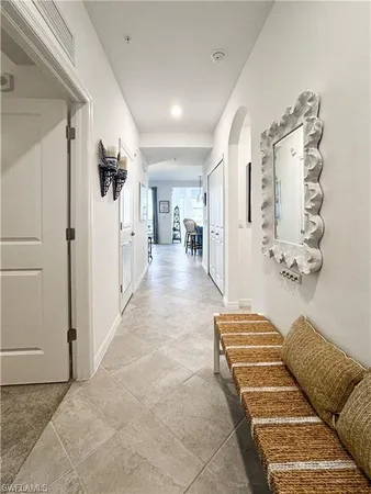 a view of a bedroom with furniture and a rug