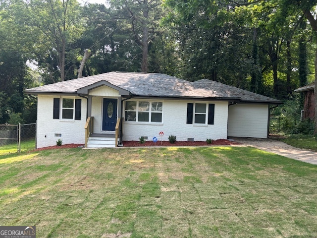 2349 Ousley Court Decatur, GA 30032 - Photo 1 of 1 a front view of a house with a garden