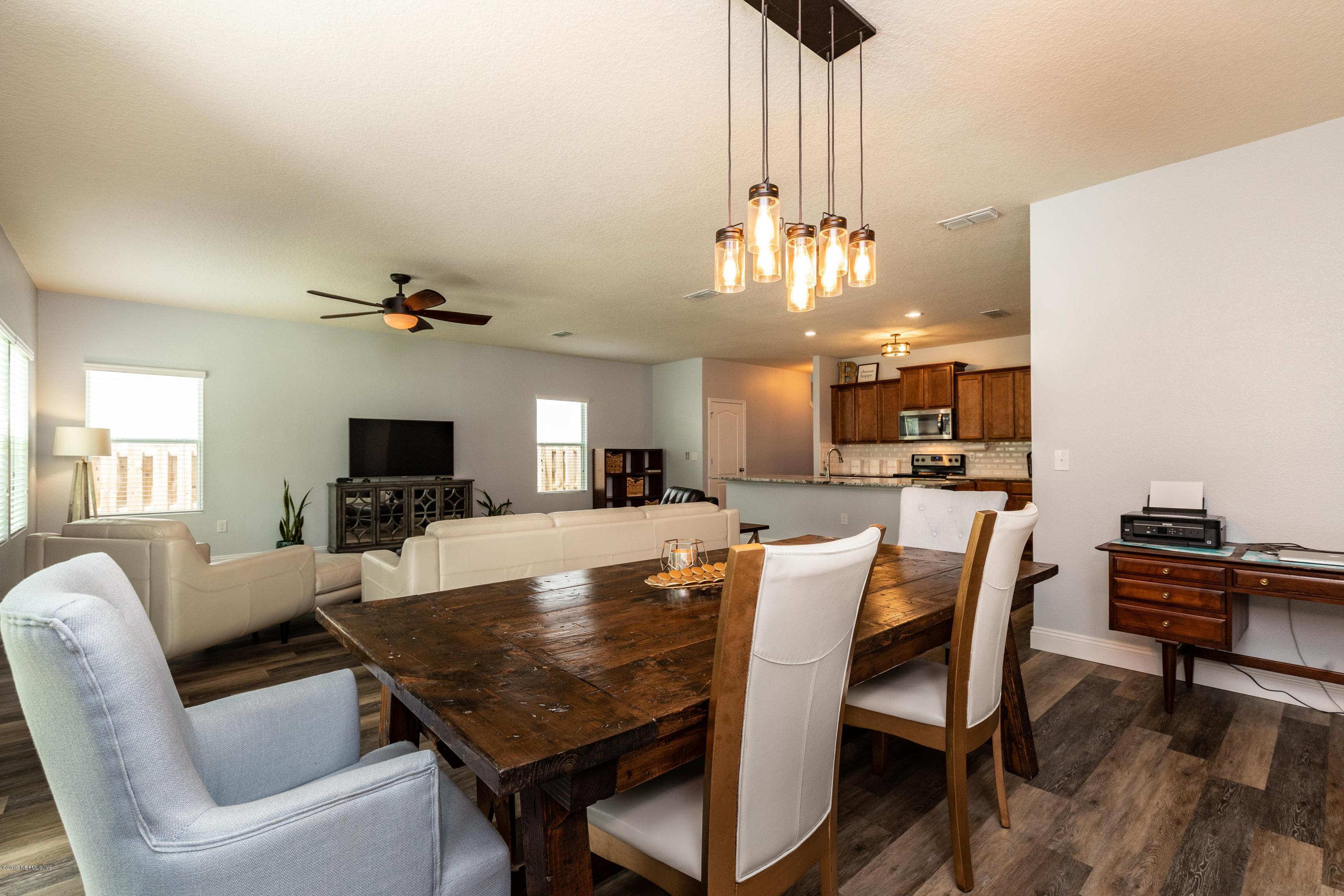 194 Ashby Landing Way St. Augustine, FL 32086 - Photo 14 of 41 a view of a dining room with furniture