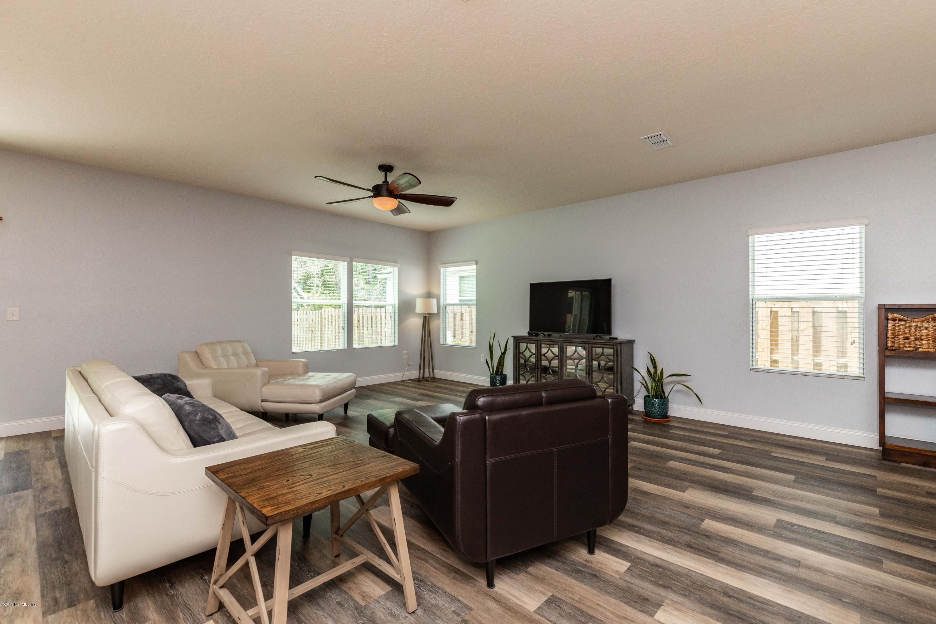 194 Ashby Landing Way St. Augustine, FL 32086 - Photo 16 of 41 a living room with furniture and a flat screen tv