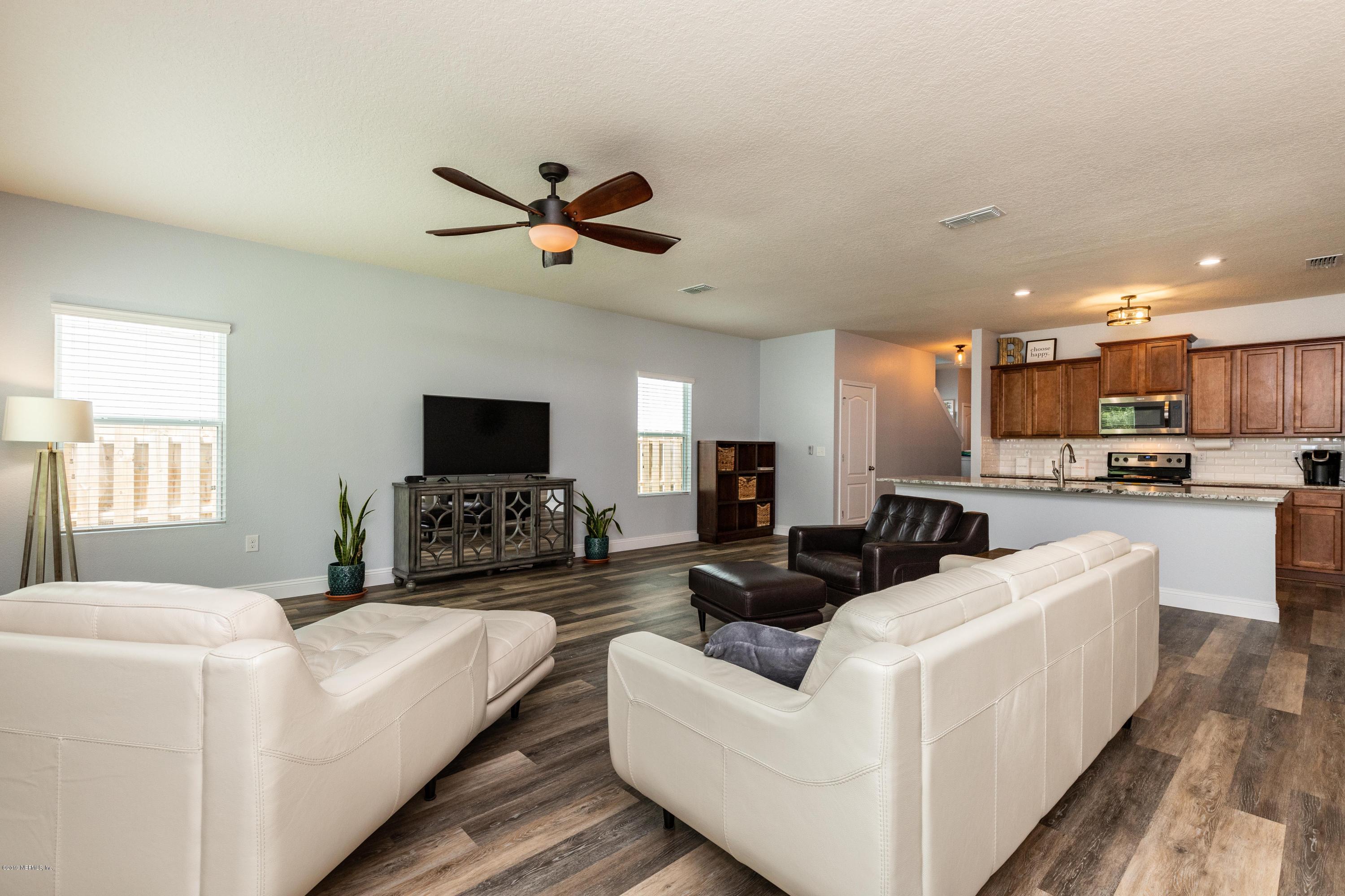 194 Ashby Landing Way St. Augustine, FL 32086 - Photo 19 of 41 a living room with furniture and a flat screen tv