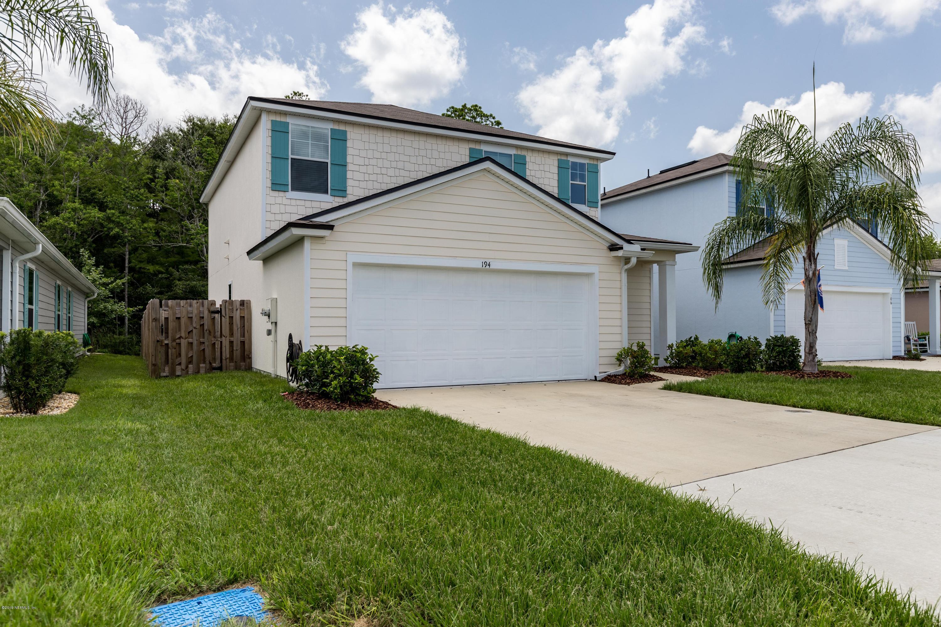 194 Ashby Landing Way St. Augustine, FL 32086 - Photo 2 of 41 a view of a white house next to a yard with potted plants