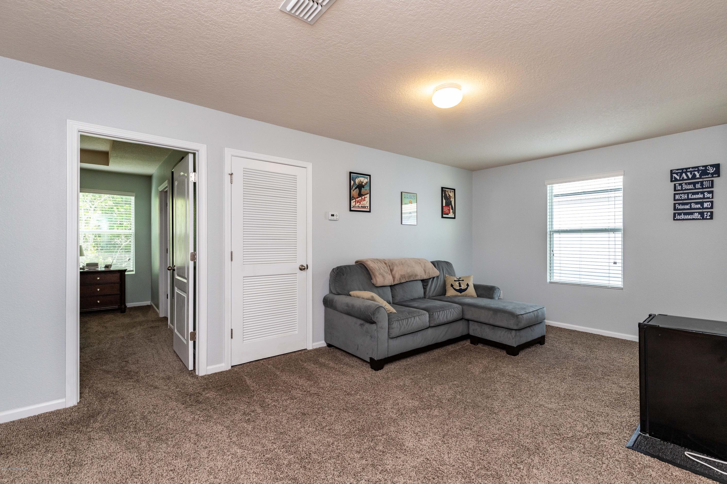 194 Ashby Landing Way St. Augustine, FL 32086 - Photo 23 of 41 a living room with furniture and a window