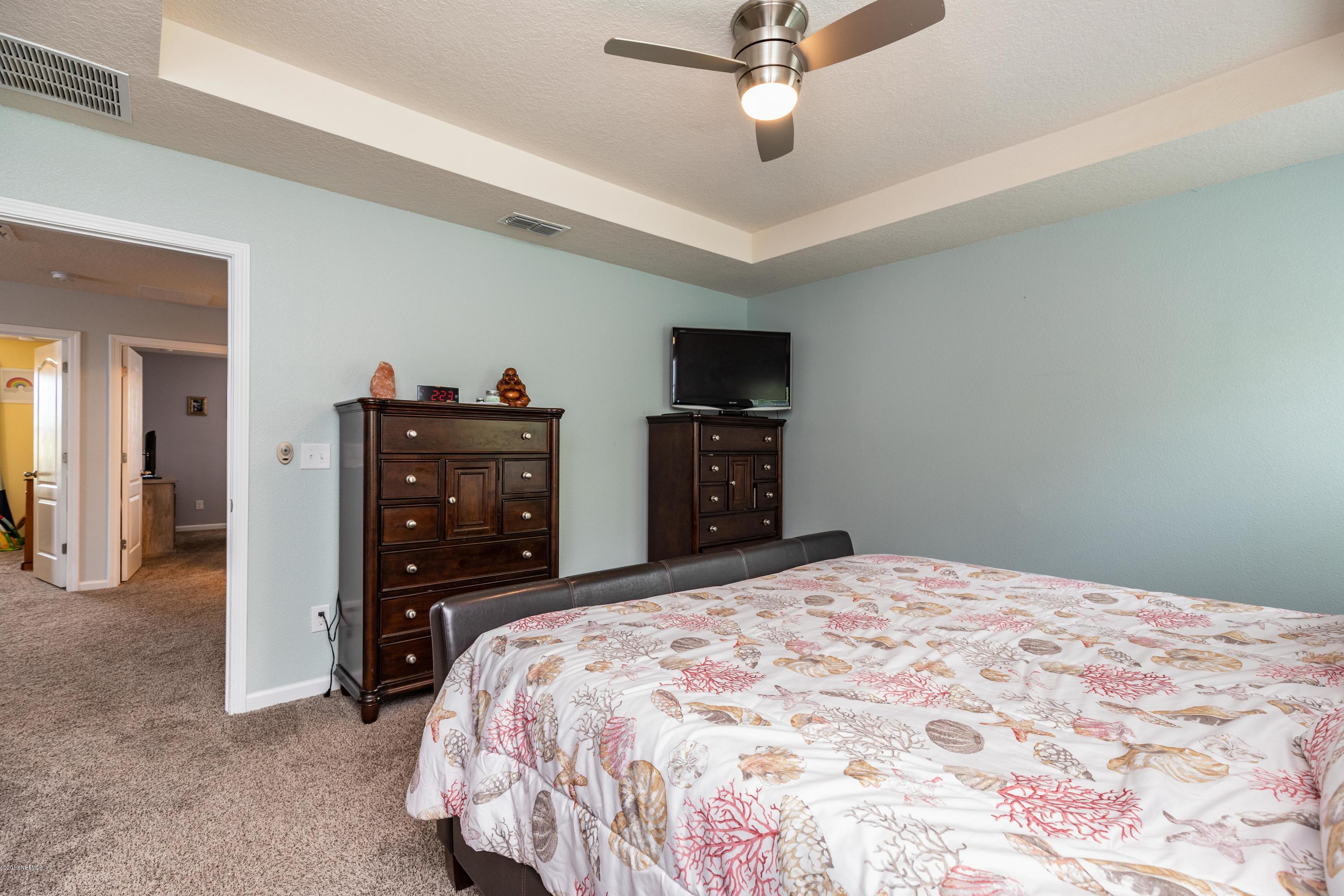 194 Ashby Landing Way St. Augustine, FL 32086 - Photo 24 of 41 a bedroom with a bed and a dresser
