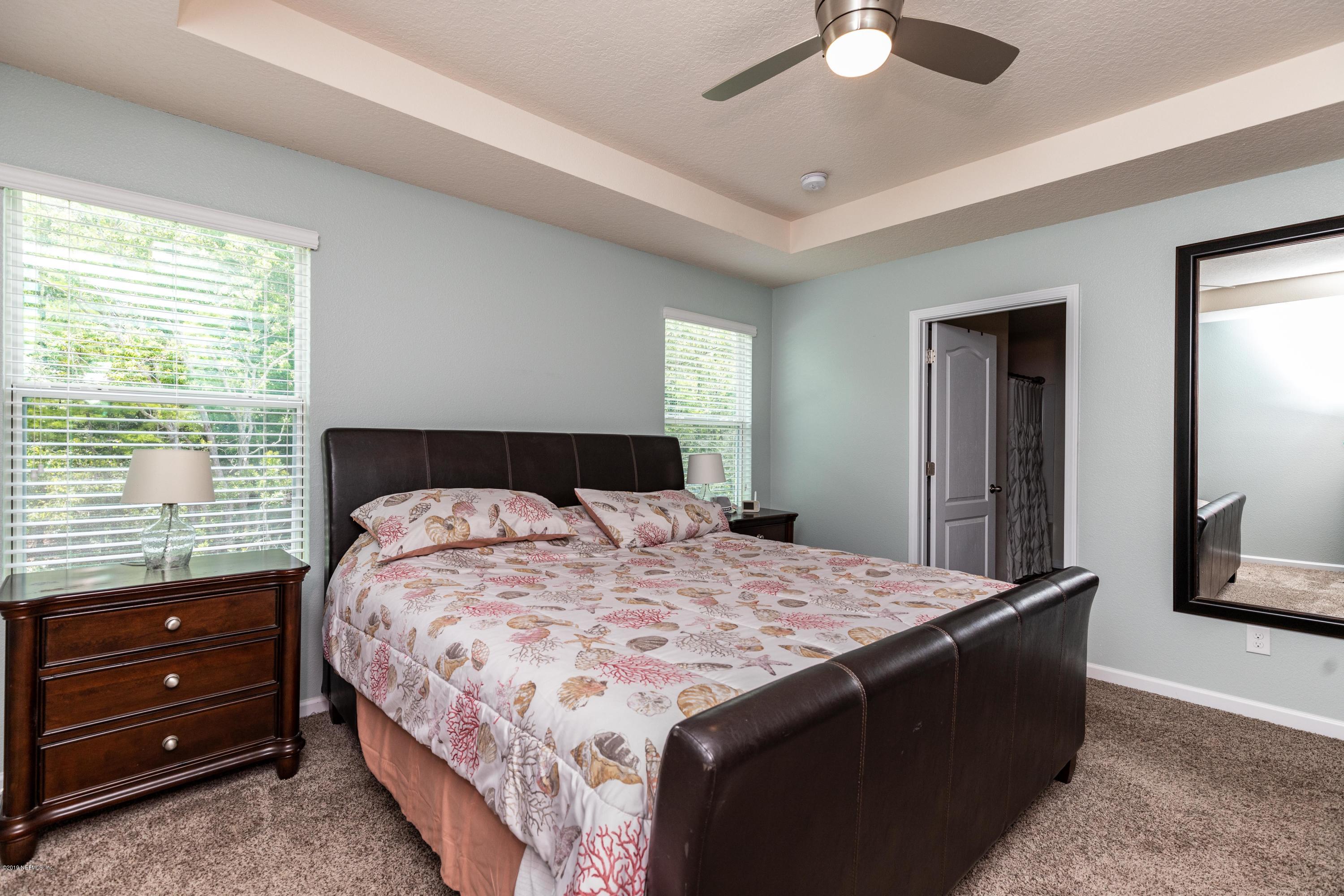 194 Ashby Landing Way St. Augustine, FL 32086 - Photo 25 of 41 a bedroom with a bed and a window