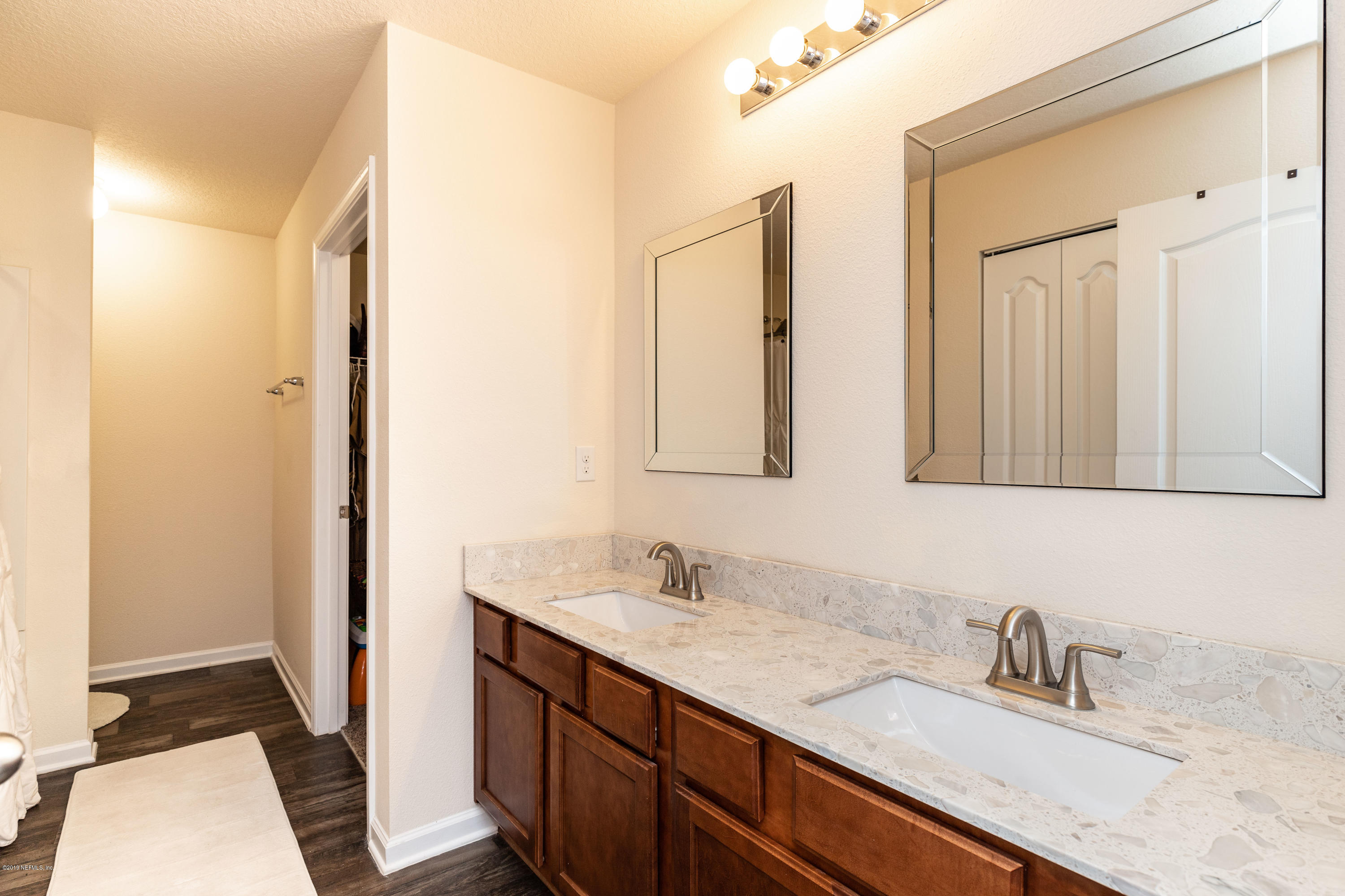 194 Ashby Landing Way St. Augustine, FL 32086 - Photo 29 of 41 a bathroom with a sink and a mirror